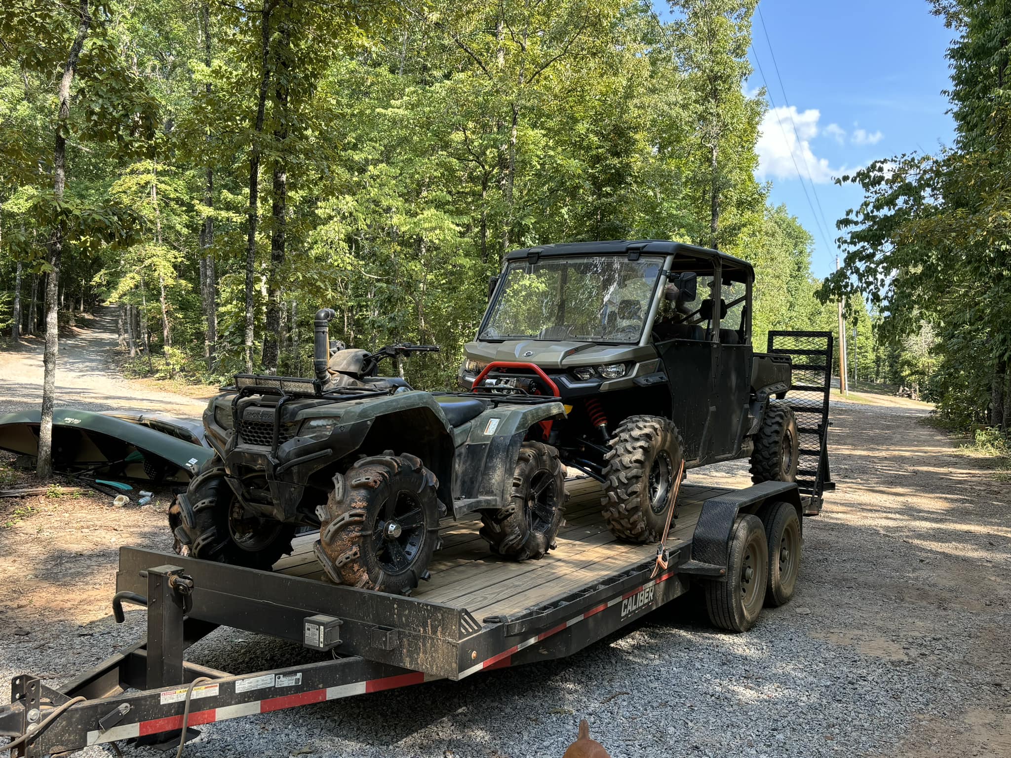 ATV and side-by-side on trailer ready for service